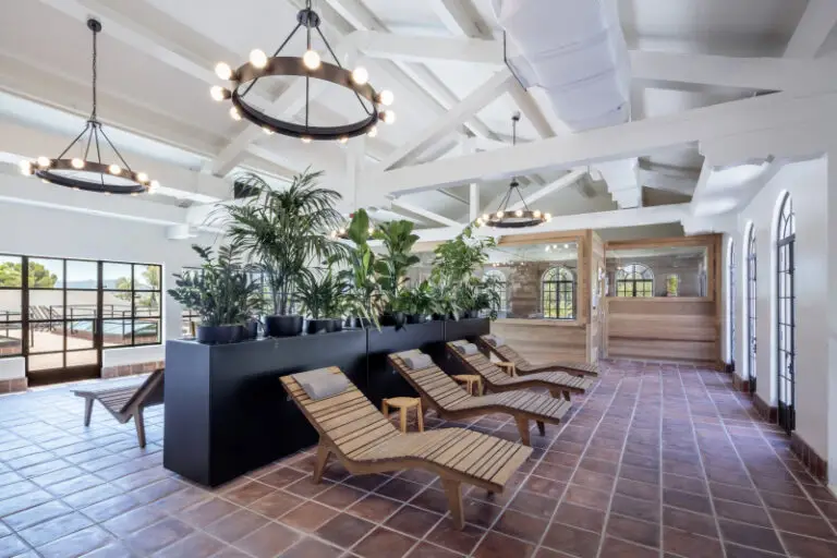 2025 Starnet Grand Prize project: Murrieta Hot Springs entry with reclining wooden slat chairs and brown floor tile