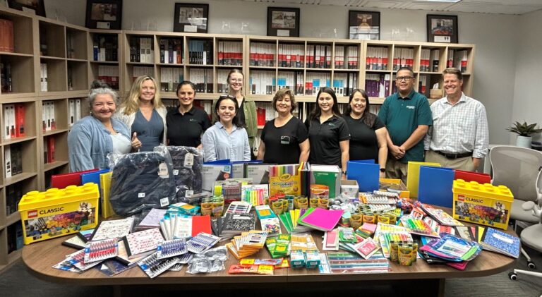 UMI team showcases Donation to Santa Fe Springs Back to School Backpack Program