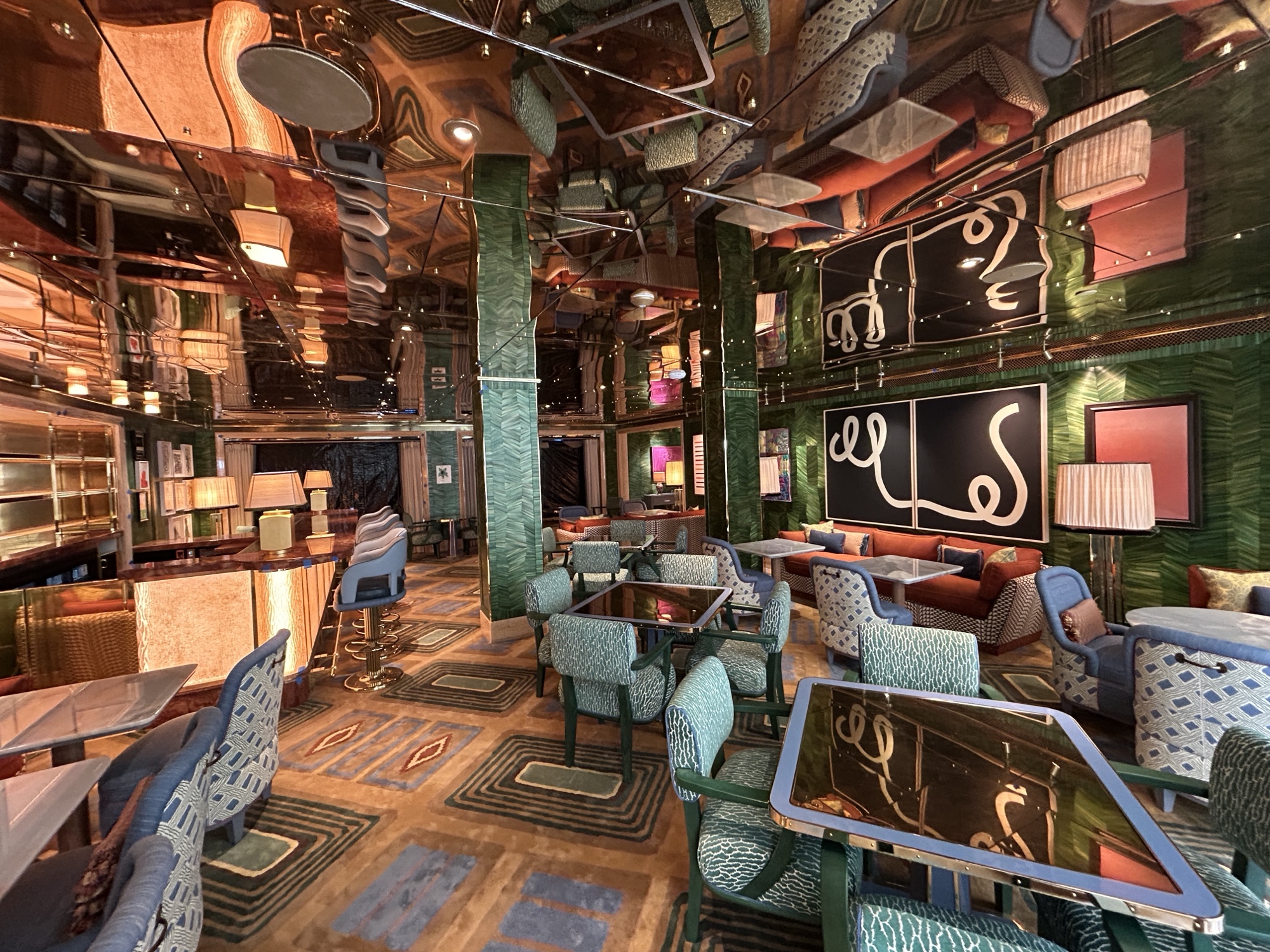 La Monique- Oceana Bar / Restaurant in dark greens, teals with padded seating with a 1920´s retro vibe